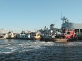 047 WE ARE IN. LAST SALUTE BY TUGS